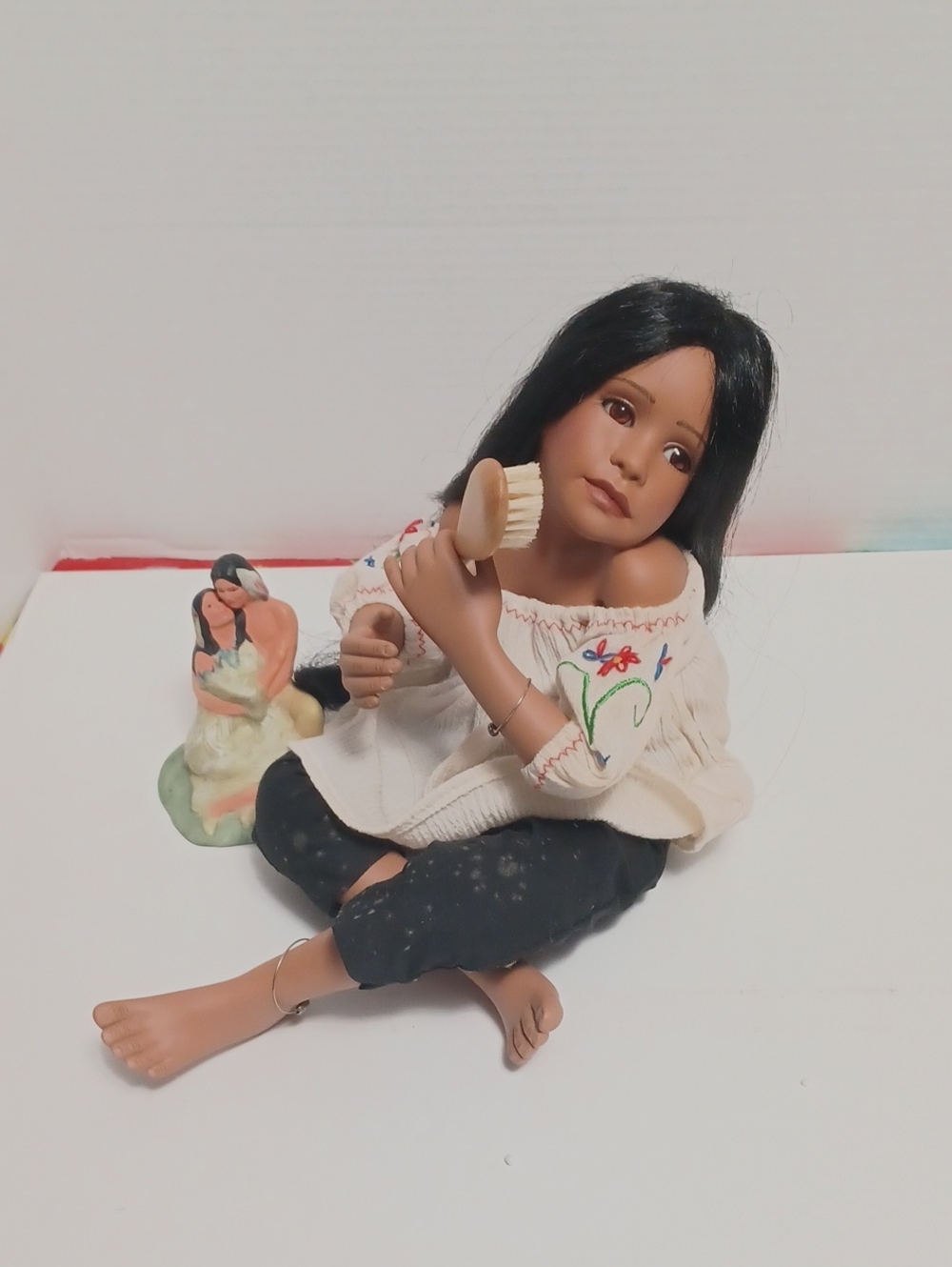 Artisan Black-Haired Porcelain Doll in Embroidered Cream Blouse and Black Pants